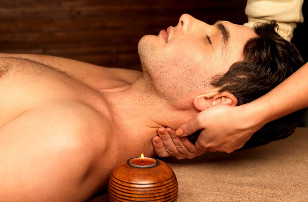Man having neck massage in the spa salon